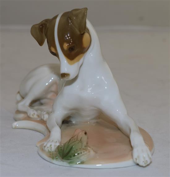 A Nymphenburg polychrome figure of a recumbent hound and frog, modelled by T. Karner, late 20th century, length 17cm (6.7in.)